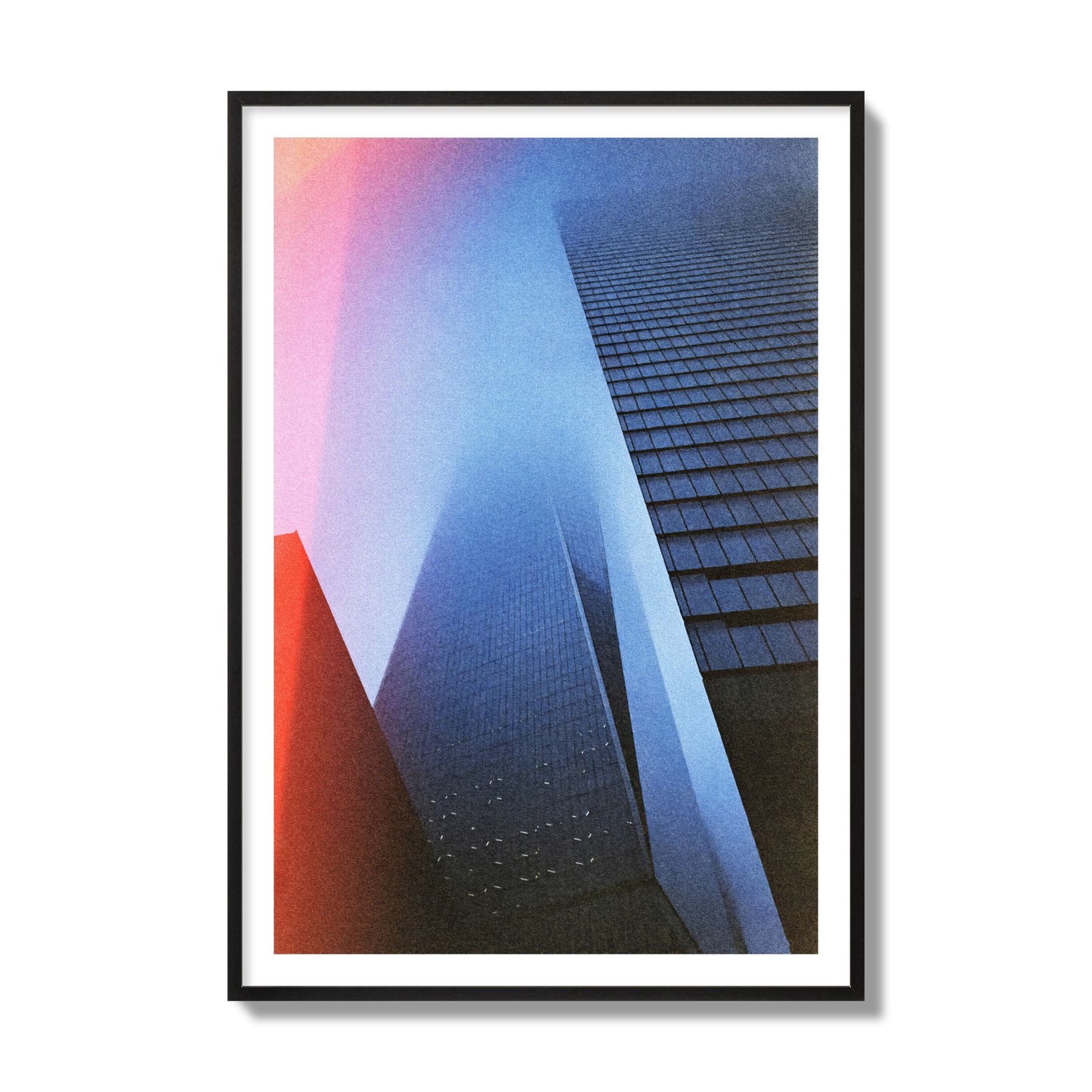 Fine art street photograph of the World Trade Center highlighting geometric shapes, with a dreamlike, cinematic feel in predominantly blue and red hues, archival pigment print, collector size, black frame.
