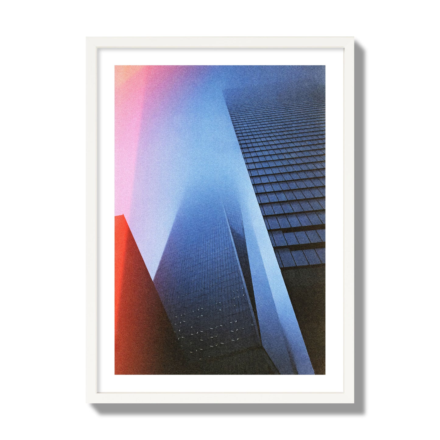 Fine art street photograph of the World Trade Center highlighting geometric shapes, with a dreamlike, cinematic feel in predominantly blue and red hues, archival pigment print, giant size, white frame.