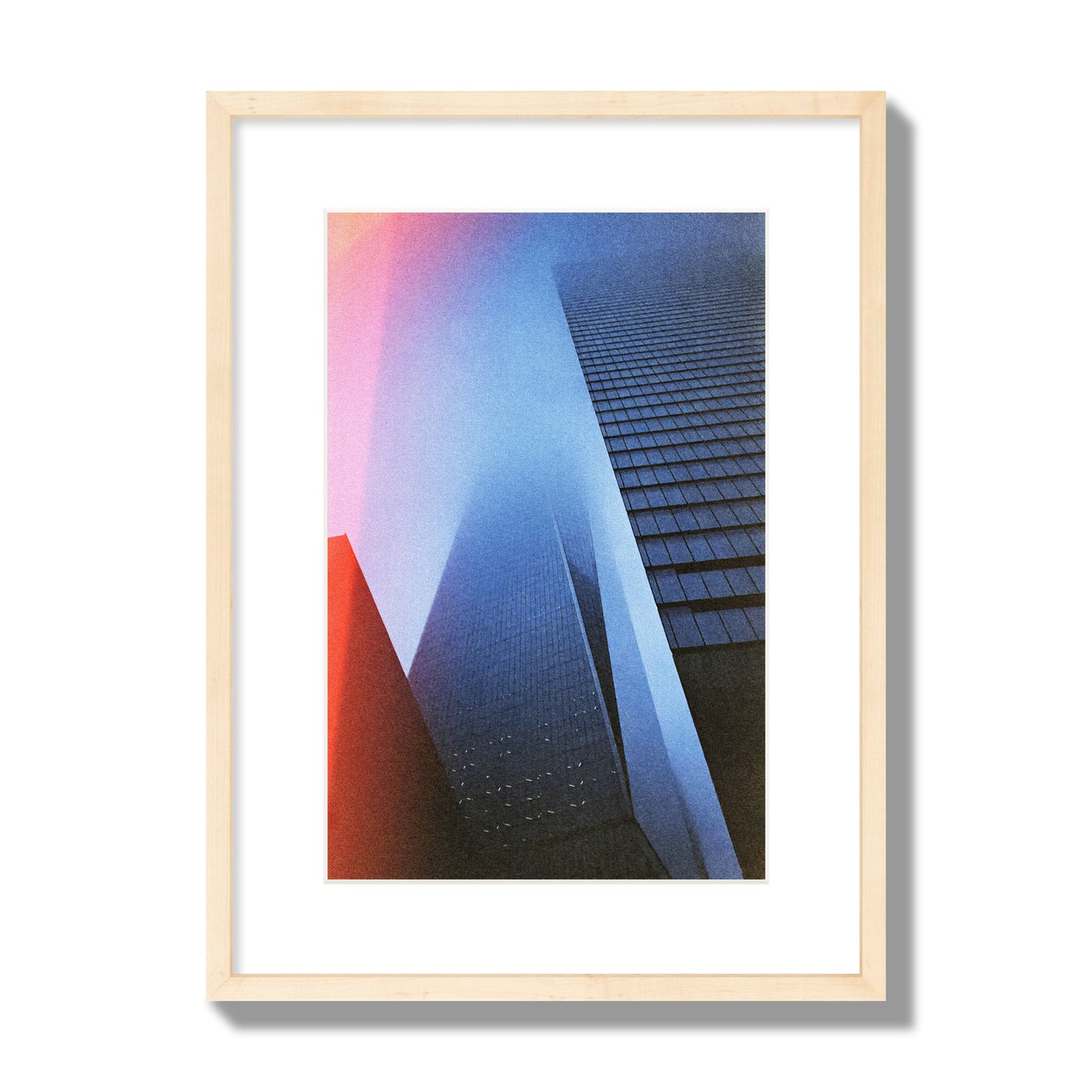 Fine art street photograph of the World Trade Center highlighting geometric shapes, with a dreamlike, cinematic feel in predominantly blue and red hues, archival pigment print, medium size, natural wood frame.