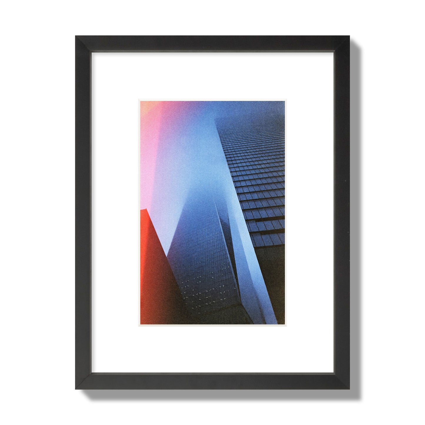 Fine art street photograph of the World Trade Center highlighting geometric shapes, with a dreamlike, cinematic feel in predominantly blue and red hues, archival pigment print, small size in a black frame.
