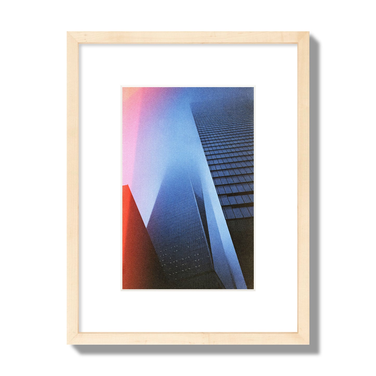 Fine art street photograph of the World Trade Center highlighting geometric shapes, with a dreamlike, cinematic feel in predominantly blue and red hues, archival pigment print, small size in a natural wood frame.