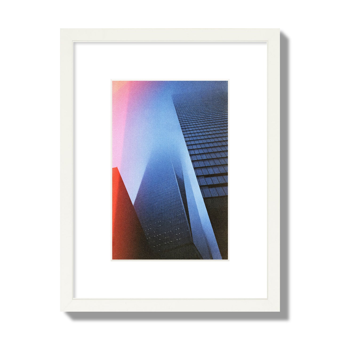Fine art street photograph of the World Trade Center highlighting geometric shapes, with a dreamlike, cinematic feel in predominantly blue and red hues, archival pigment print, small size in a white frame.