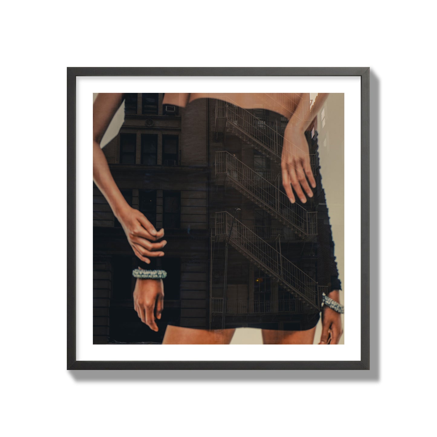 Fine art photograph of two women in black dresses, with the pattern of a fire escape reflected across the fabric, archival pigment print, collector size, black frame.