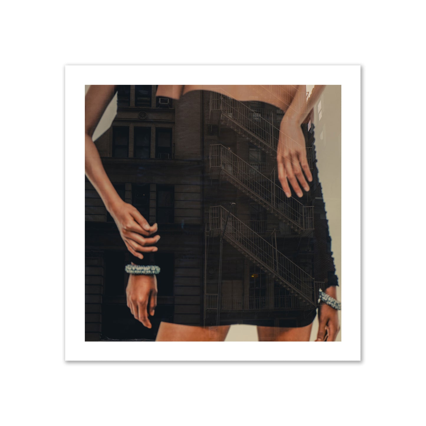 Fine art photograph of two women in black dresses, with the pattern of a fire escape reflected across the fabric, archival pigment print, gallery size, print.