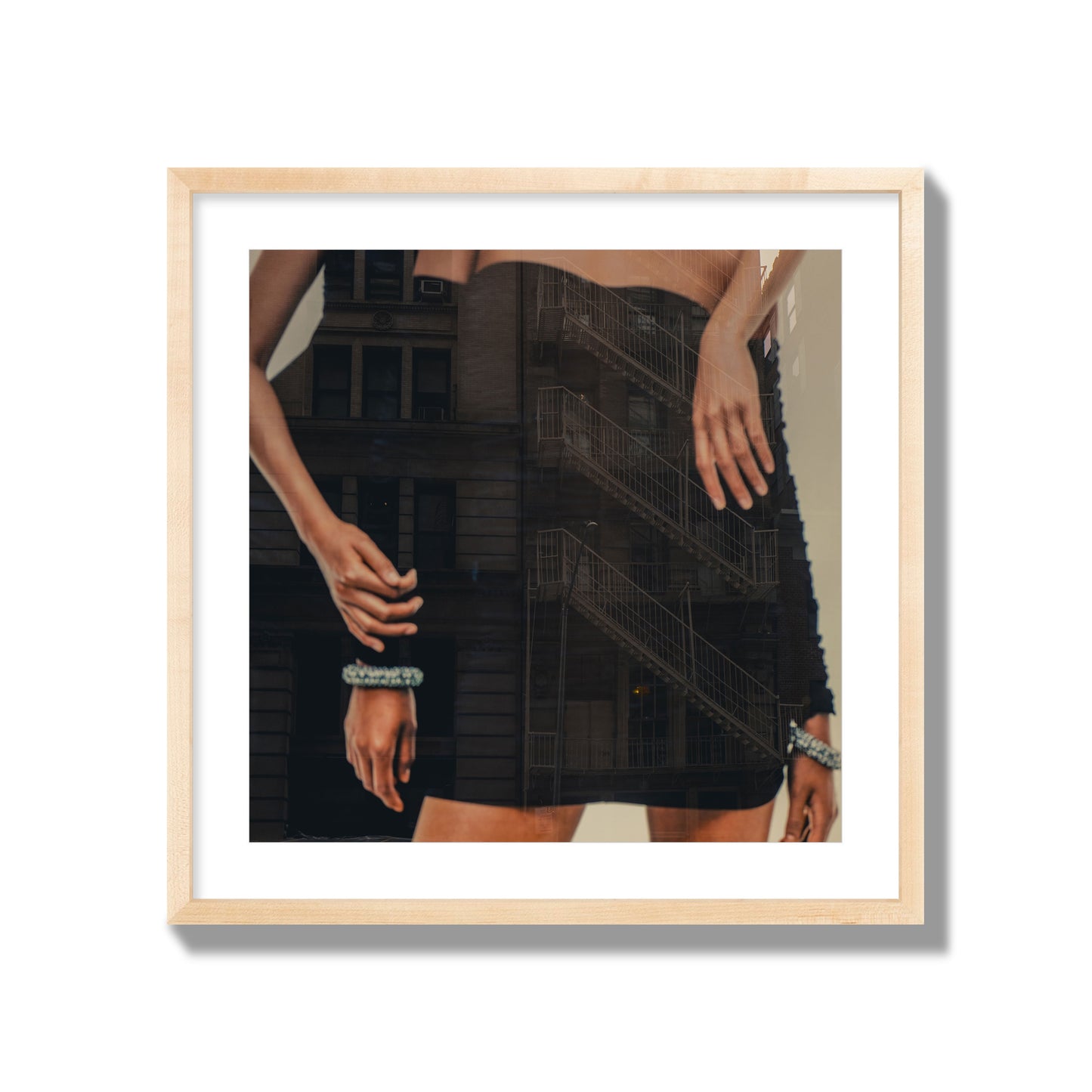 Fine art photograph of two women in black dresses, with the pattern of a fire escape reflected across the fabric, archival pigment print, giant size, natural frame.