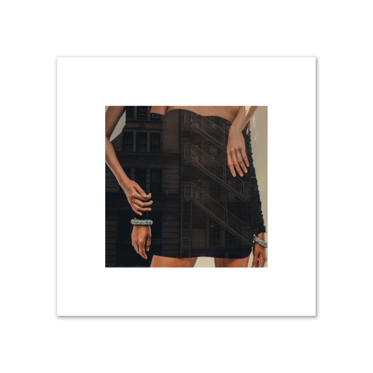Fine art photograph of two women in black dresses, with the pattern of a fire escape reflected across the fabric, archival pigment print, medium size, print.