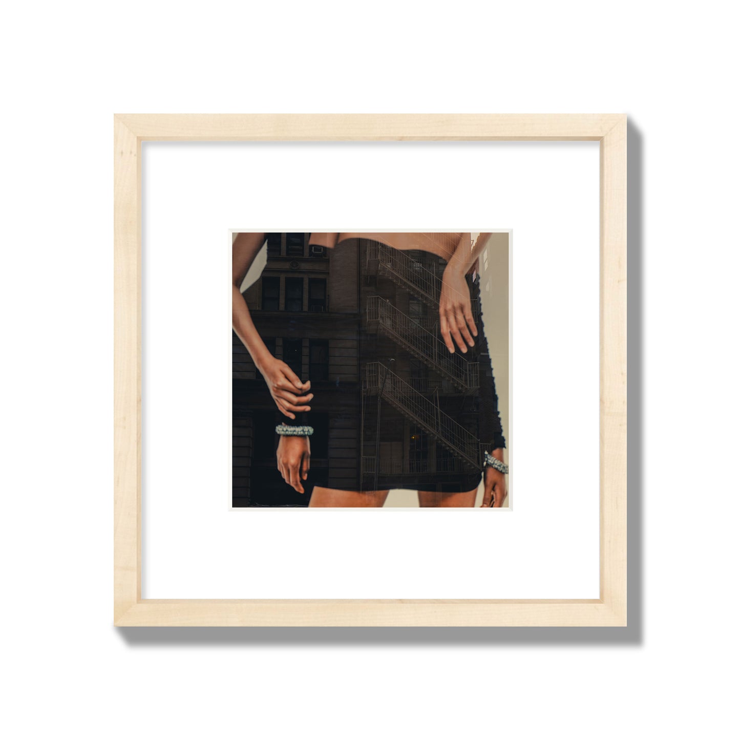Fine art photograph of two women in black dresses, with the pattern of a fire escape reflected across the fabric, archival pigment print, small size, natural frame.