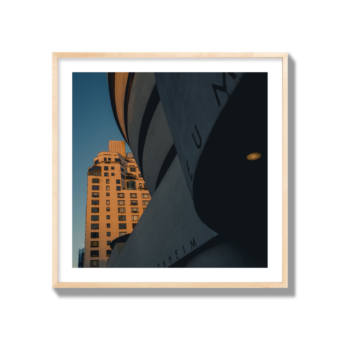 Fine art photograph of the Guggenheim Museum at dusk, archival pigment print, collector size, natural wood frame.