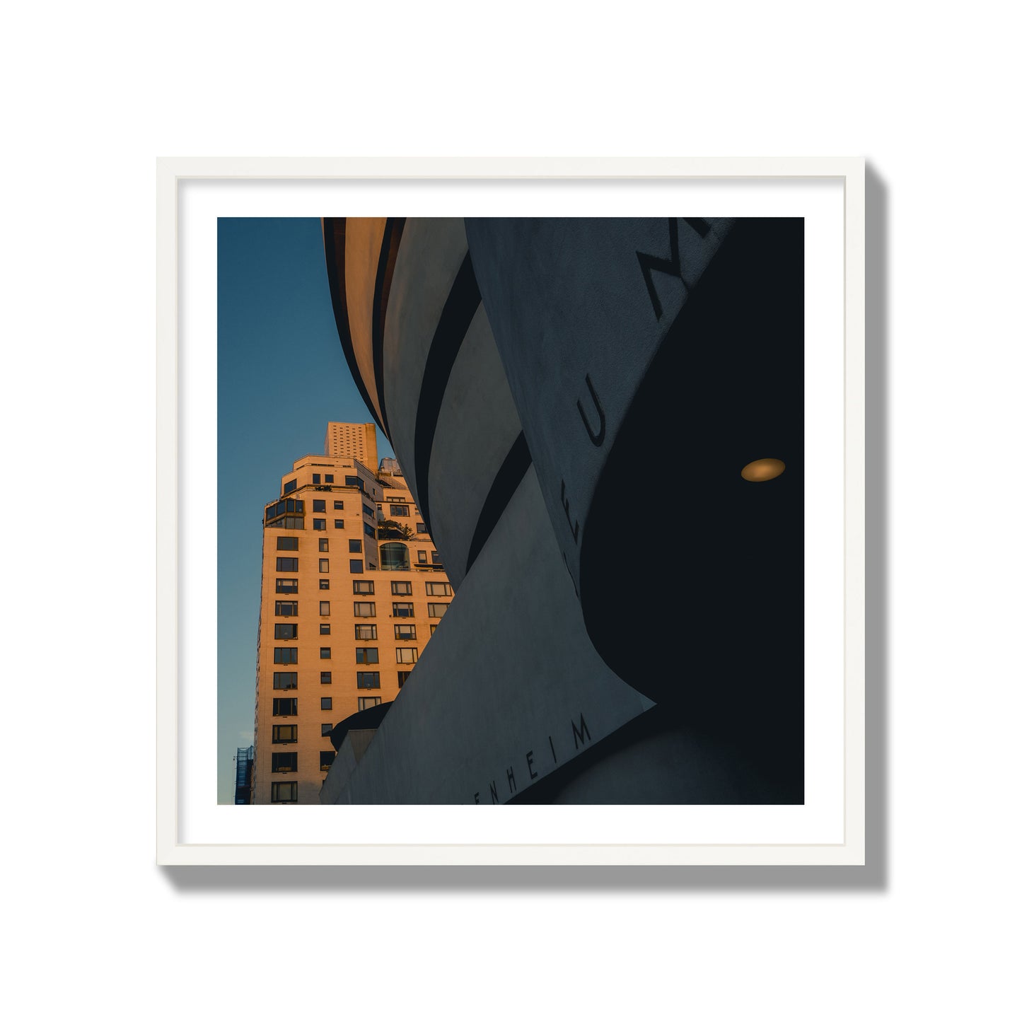Fine art photograph of the Guggenheim Museum at dusk, archival pigment print, collector size, white frame.