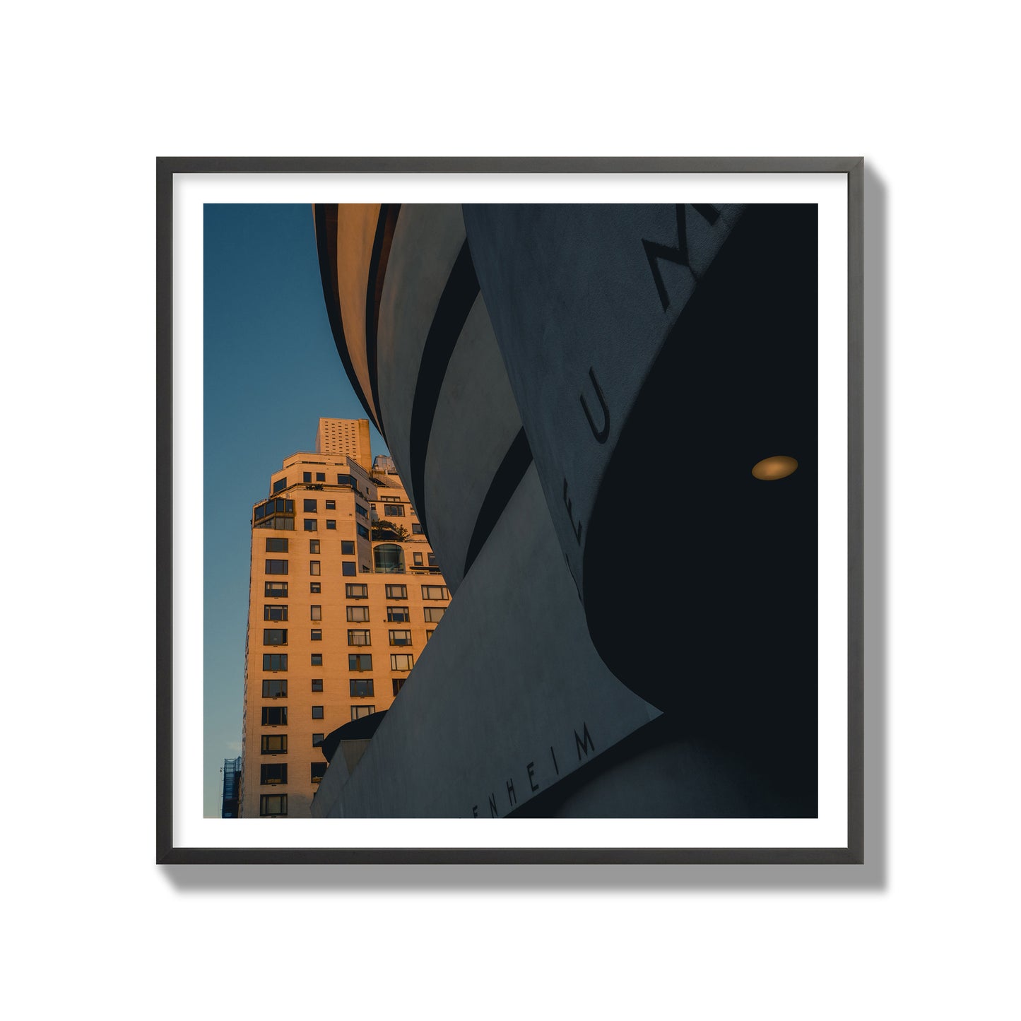 Fine art photograph of the Guggenheim Museum at dusk, archival pigment print, gallery size, black frame.