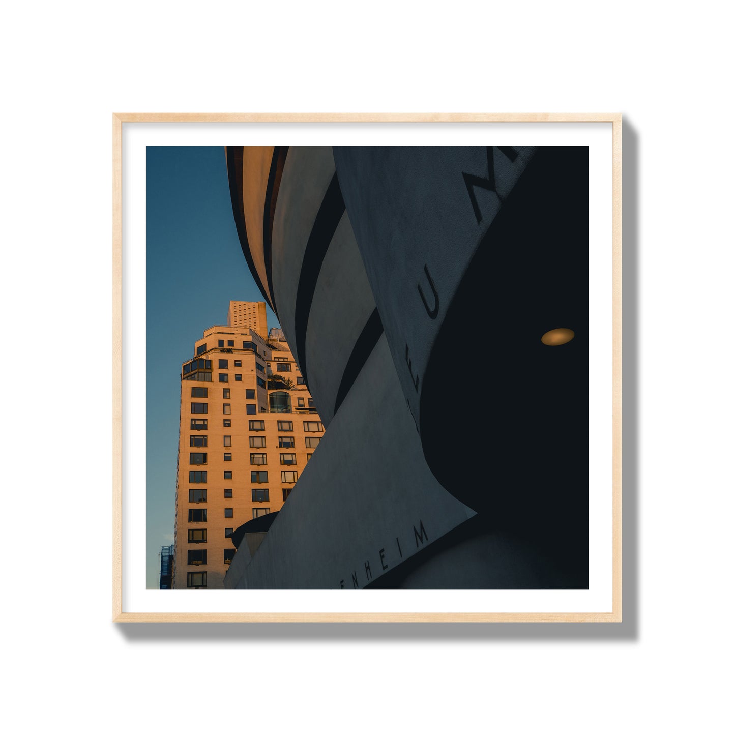 Fine art photograph of the Guggenheim Museum at dusk, archival pigment print, gallery size, natural wood frame.