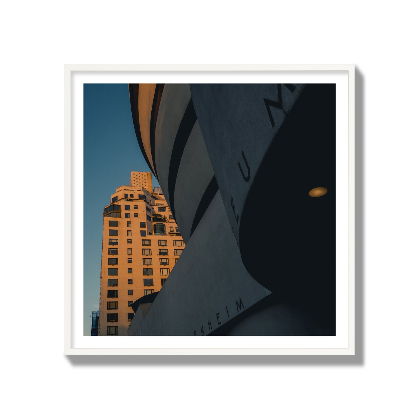 Fine art photograph of the Guggenheim Museum at dusk, archival pigment print, gallery size, white frame.