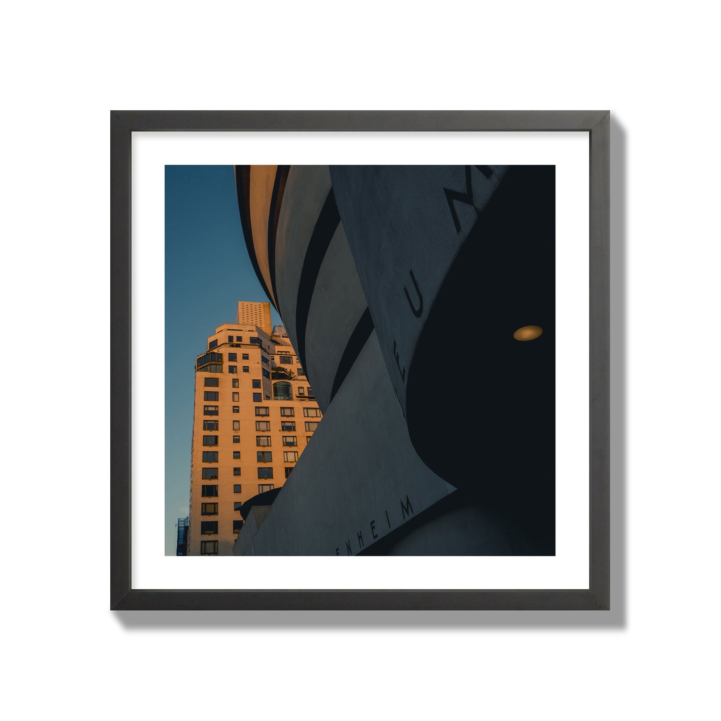 Fine art photograph of the Guggenheim Museum at dusk, archival pigment print, giant size, black frame.