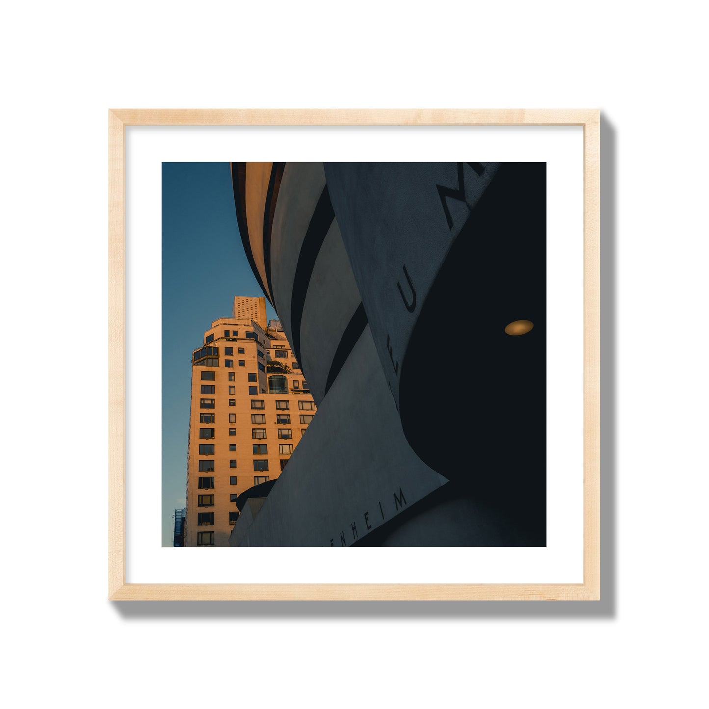 Fine art photograph of the Guggenheim Museum at dusk, archival pigment print, giant size, natural wood frame.