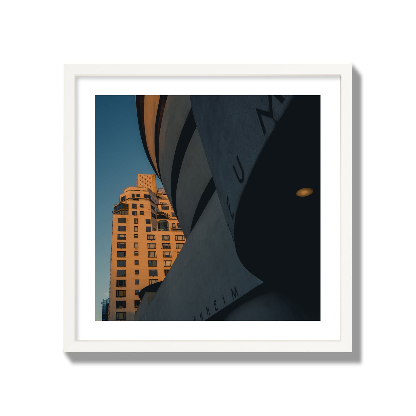 Fine art photograph of the Guggenheim Museum at dusk, archival pigment print, giant size, white frame.