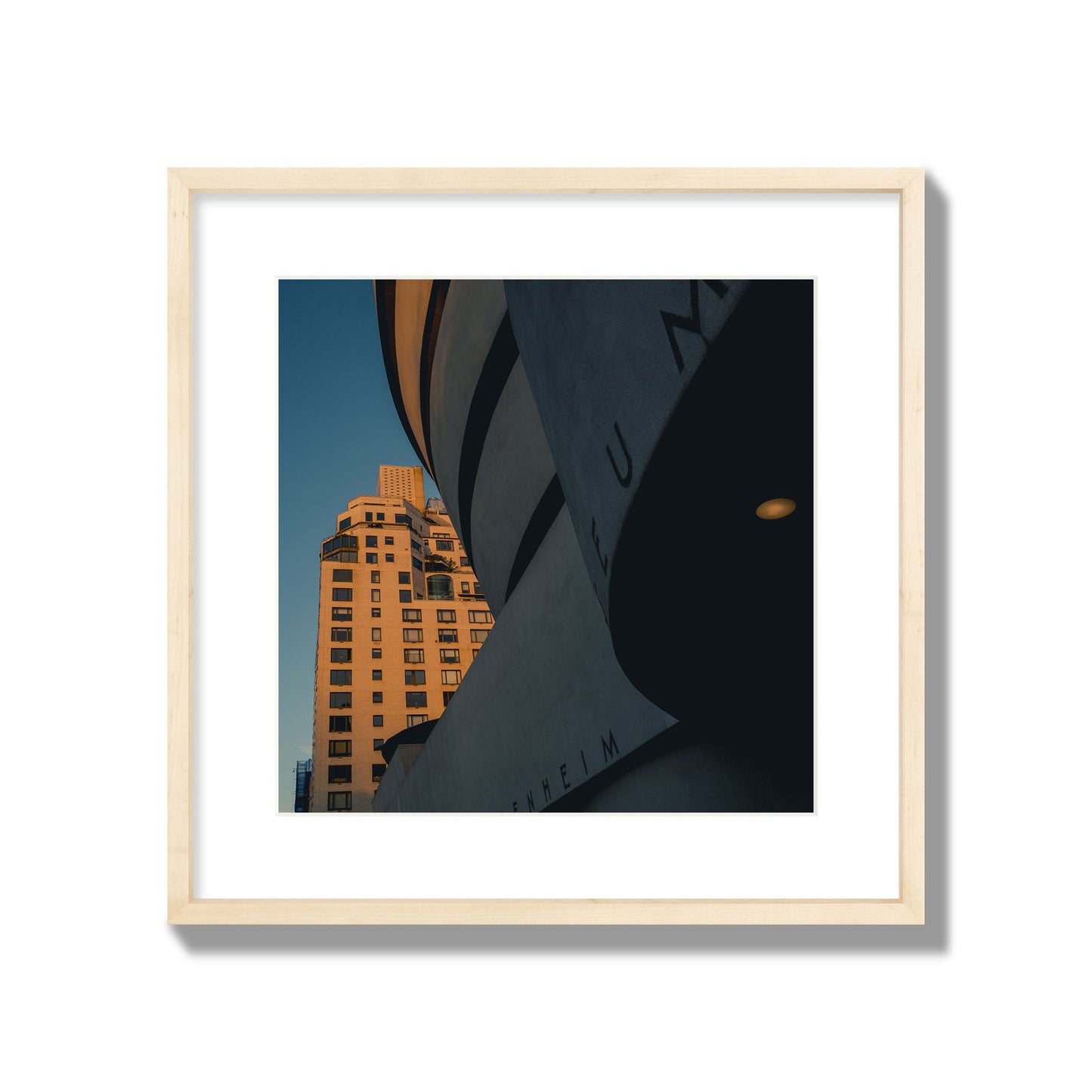 Fine art photograph of the Guggenheim Museum at dusk, archival pigment print, large size, natural wood frame.
