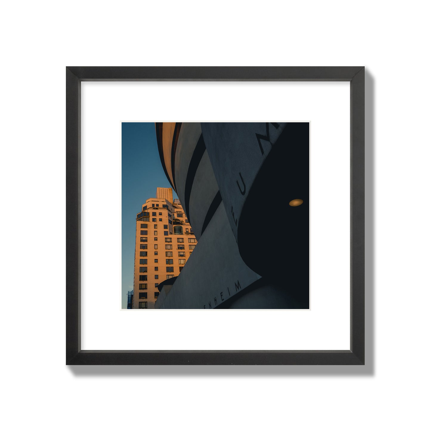 Fine art photograph of the Guggenheim Museum at dusk, archival pigment print, medium size, black frame.