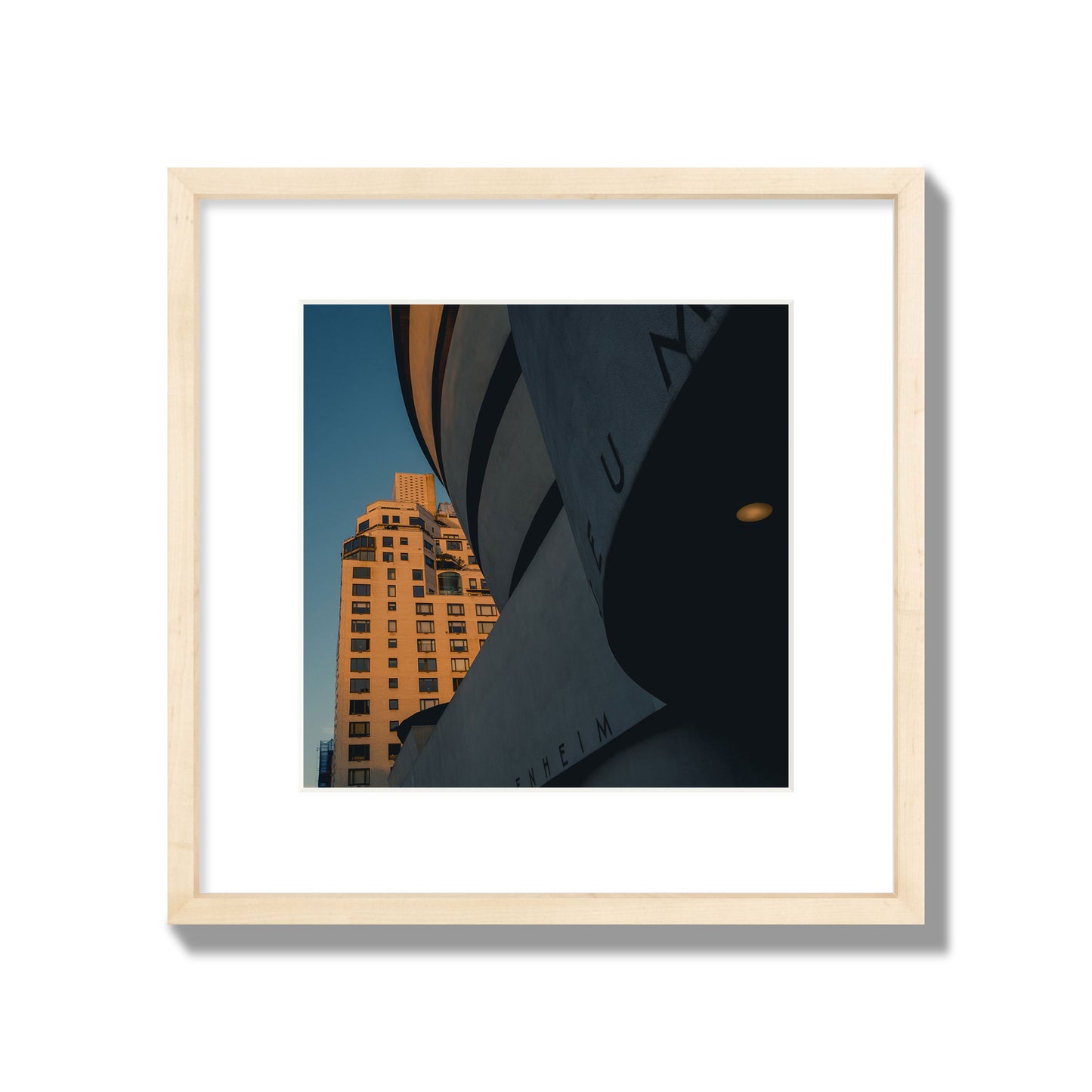 Fine art photograph of the Guggenheim Museum at dusk, archival pigment print, medium size, natural wood frame.