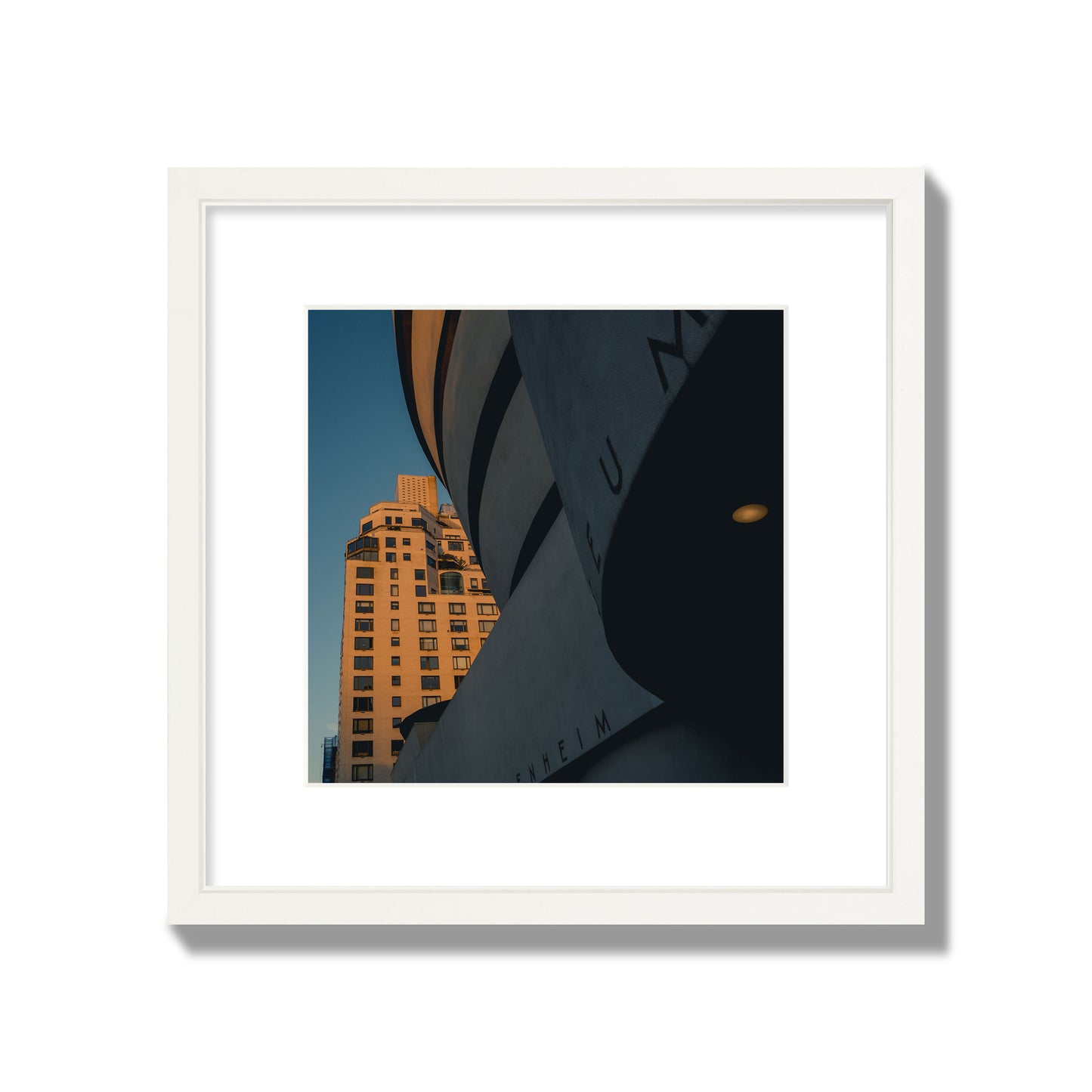 Fine art photograph of the Guggenheim Museum at dusk, archival pigment print, medium size, white frame.