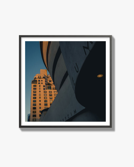 Fine art photograph of the Guggenheim Museum at dusk, archival pigment print, black frame.