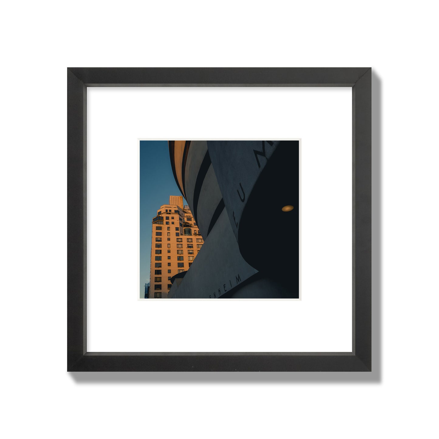 Fine art photograph of the Guggenheim Museum at dusk, archival pigment print, small size, black frame.
