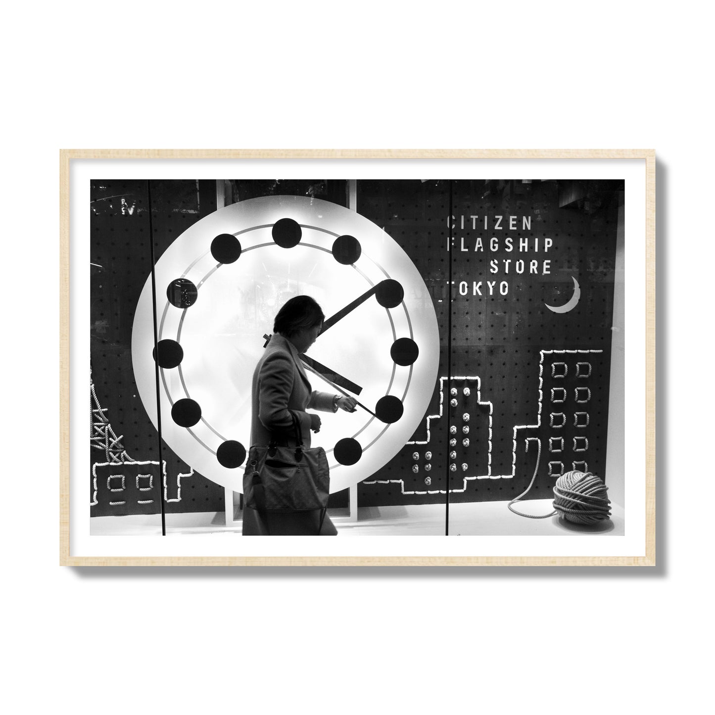 Fine art street photograph of a woman checking her watch as she walks past a giant clock on a busy Tokyo city street. Archival pigment print, collector size, natural wood frame.