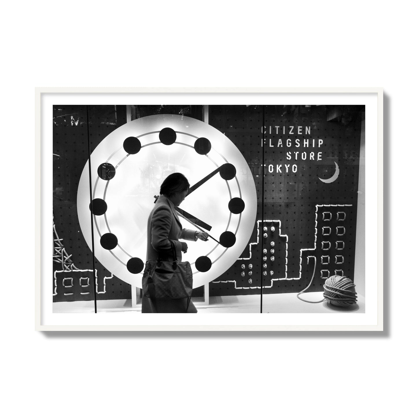 Fine art street photograph of a woman checking her watch as she walks past a giant clock on a busy Tokyo city street. Archival pigment print, collector size, white frame.