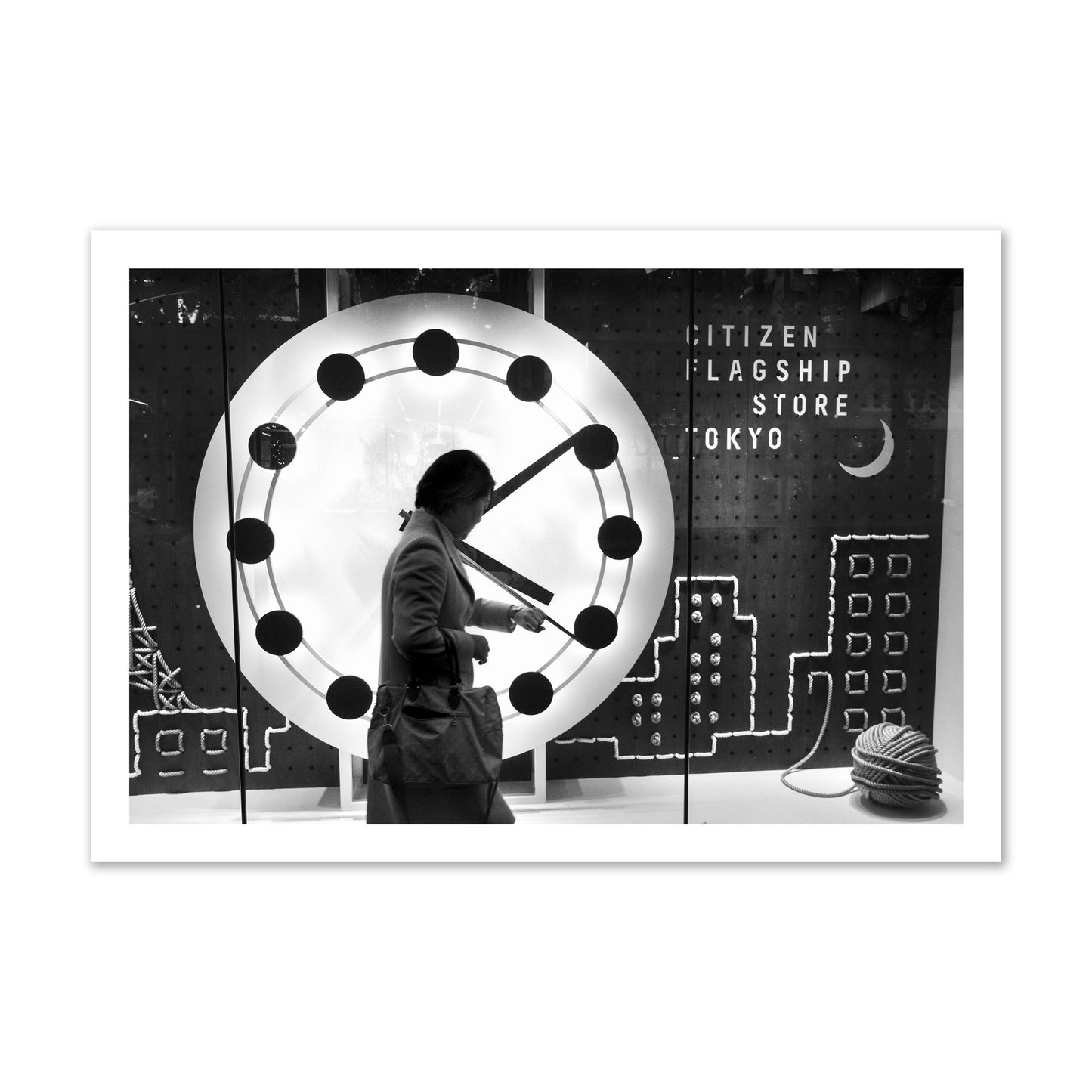 Fine art street photograph of a woman checking her watch as she walks past a giant clock on a busy Tokyo city street. Archival pigment print, gallery size, unframed.