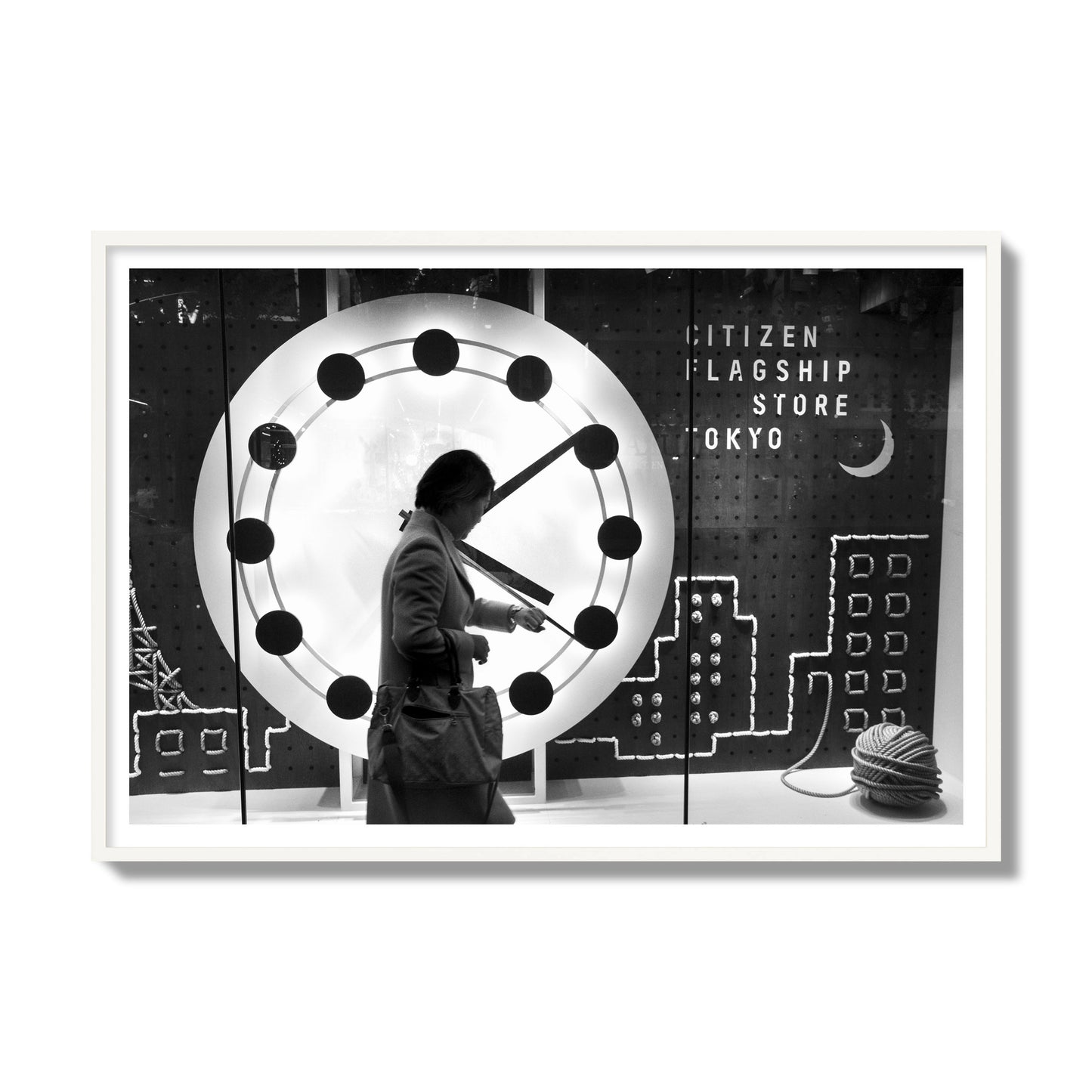 Fine art street photograph of a woman checking her watch as she walks past a giant clock on a busy Tokyo city street. Archival pigment print, gallery size, white frame.