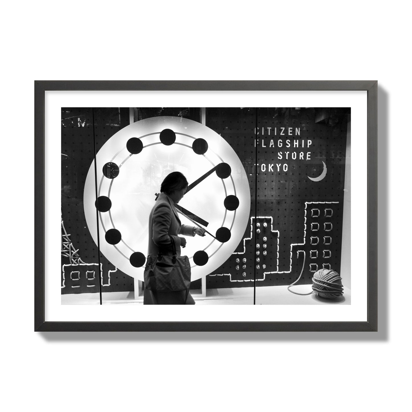 Fine art street photograph of a woman checking her watch as she walks past a giant clock on a busy Tokyo city street. Archival pigment print, giant size, black frame.