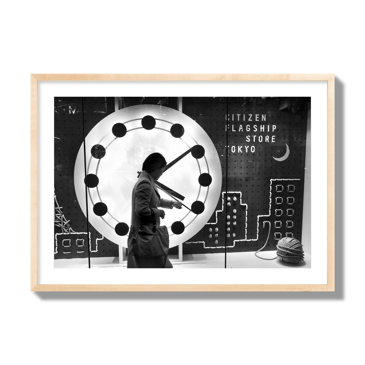 Fine art street photograph of a woman checking her watch as she walks past a giant clock on a busy Tokyo city street. Archival pigment print, giant size, natural wood frame.
