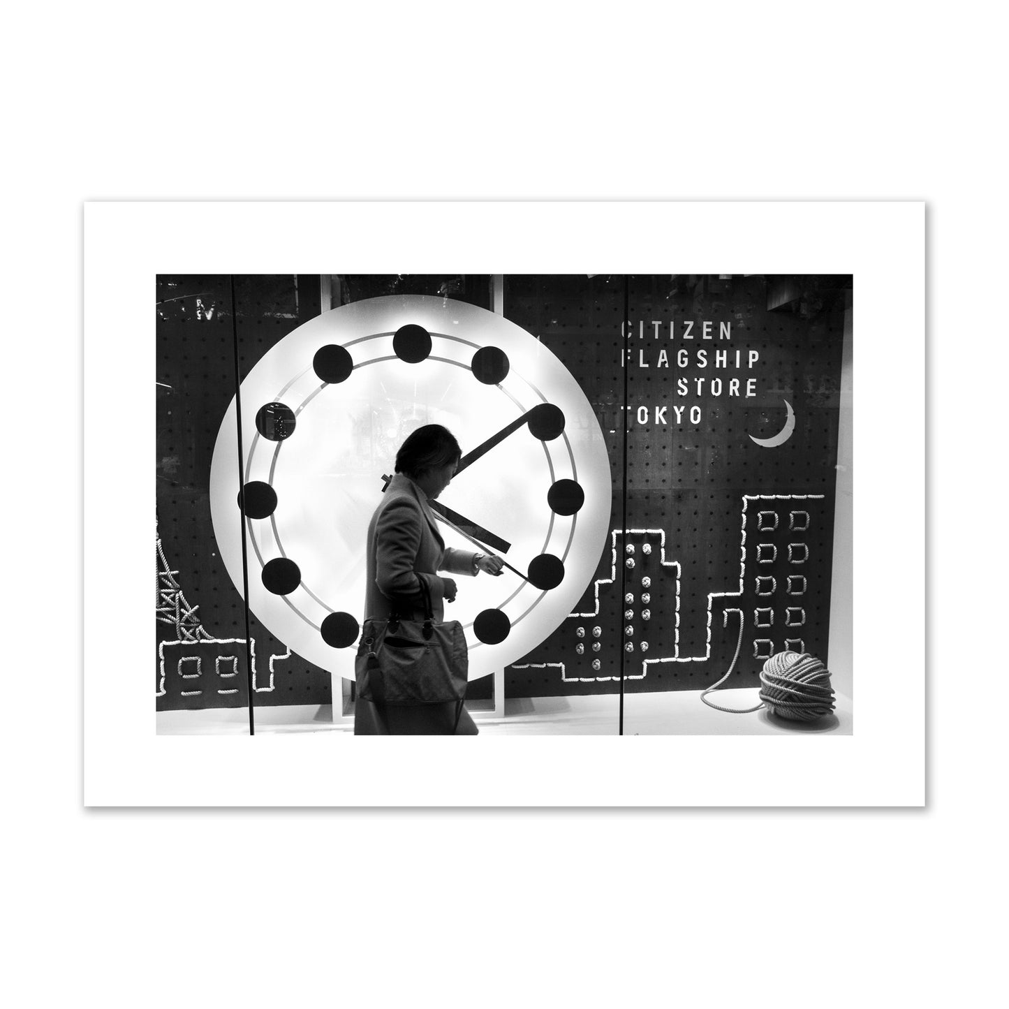 Fine art street photograph of a woman checking her watch as she walks past a giant clock on a busy Tokyo city street. Archival pigment print, giant size, unframed.