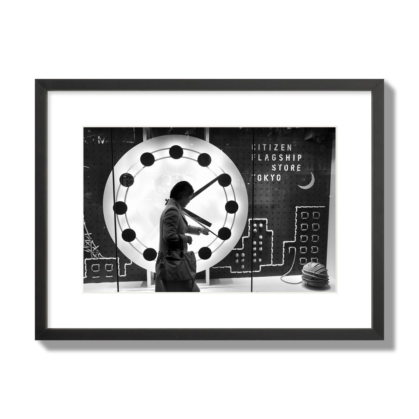 Fine art street photograph of a woman checking her watch as she walks past a giant clock on a busy Tokyo city street. Archival pigment print, medium size, black frame.