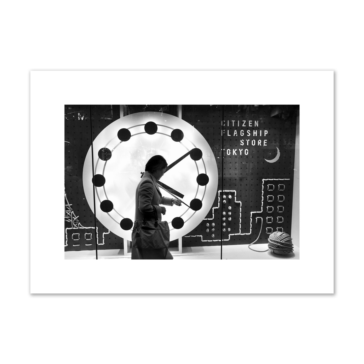 Fine art street photograph of a woman checking her watch as she walks past a giant clock on a busy Tokyo city street. Archival pigment print, medium size, unframed.
