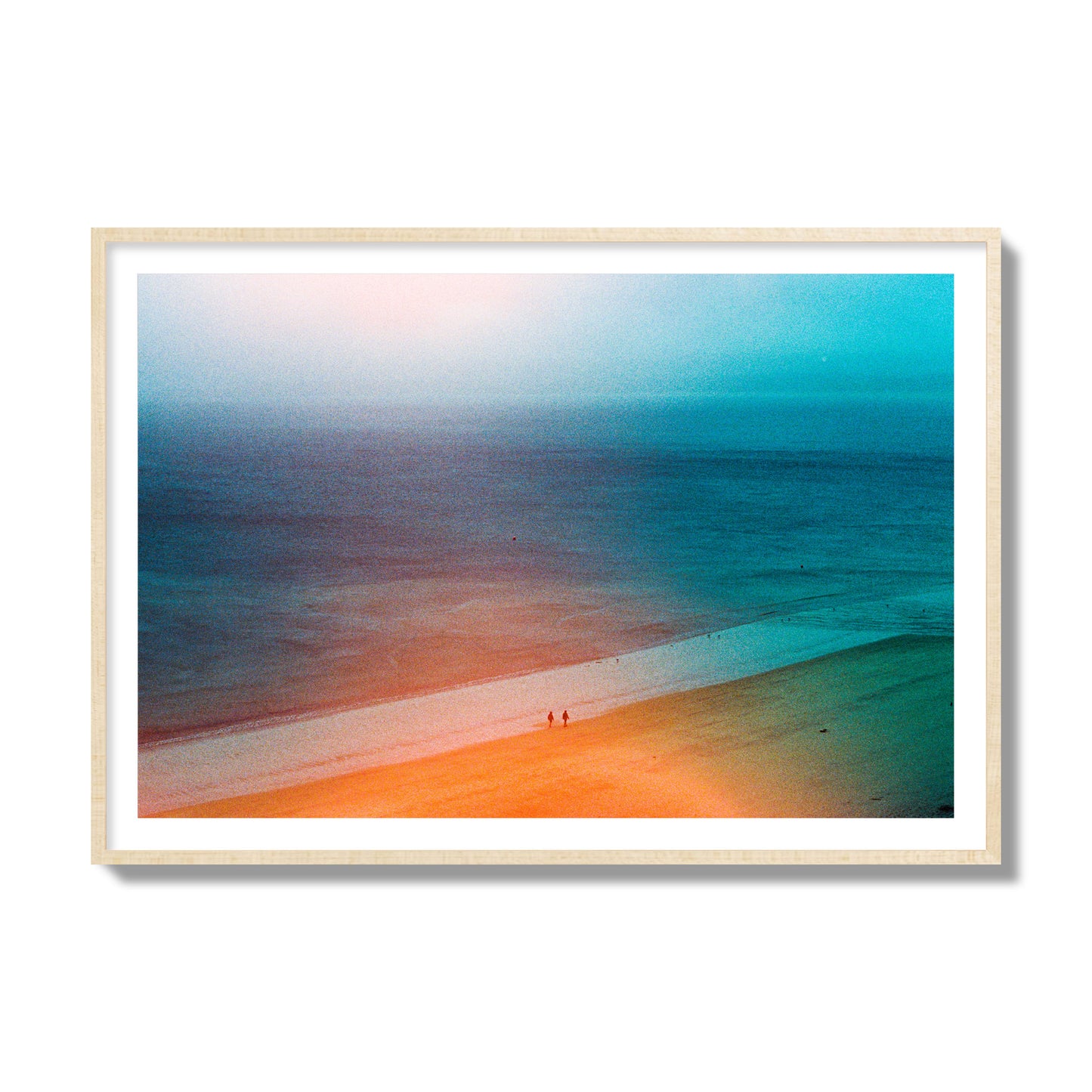 Fine art street photograph of a serene beach with two figures walking in the distance, captured in a dreamlike composition with soft orange and blue hues. Archival pigment print, collector size, natural wood frame.