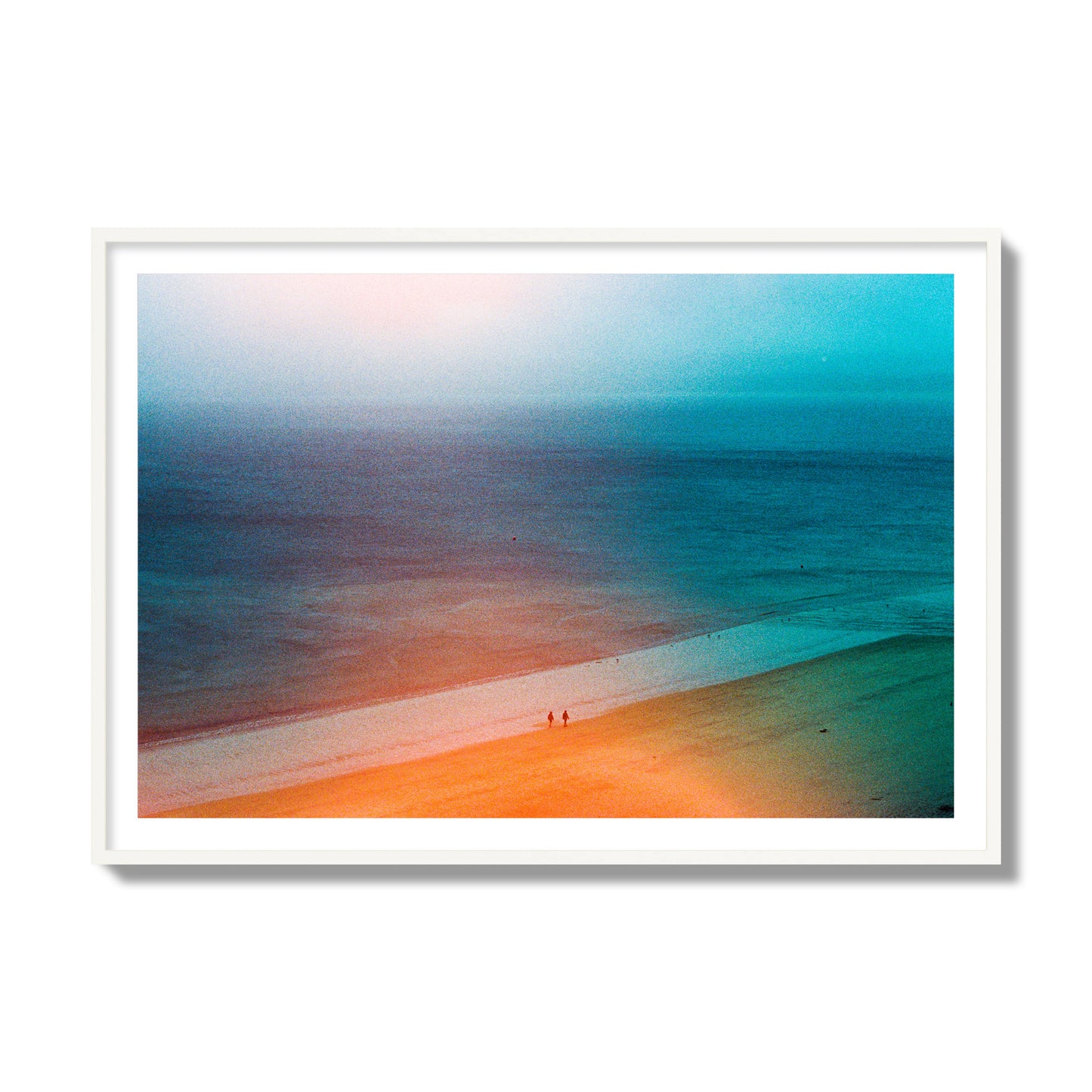 Fine art street photograph of a serene beach with two figures walking in the distance, captured in a dreamlike composition with soft orange and blue hues. Archival pigment print, collector size, white frame.