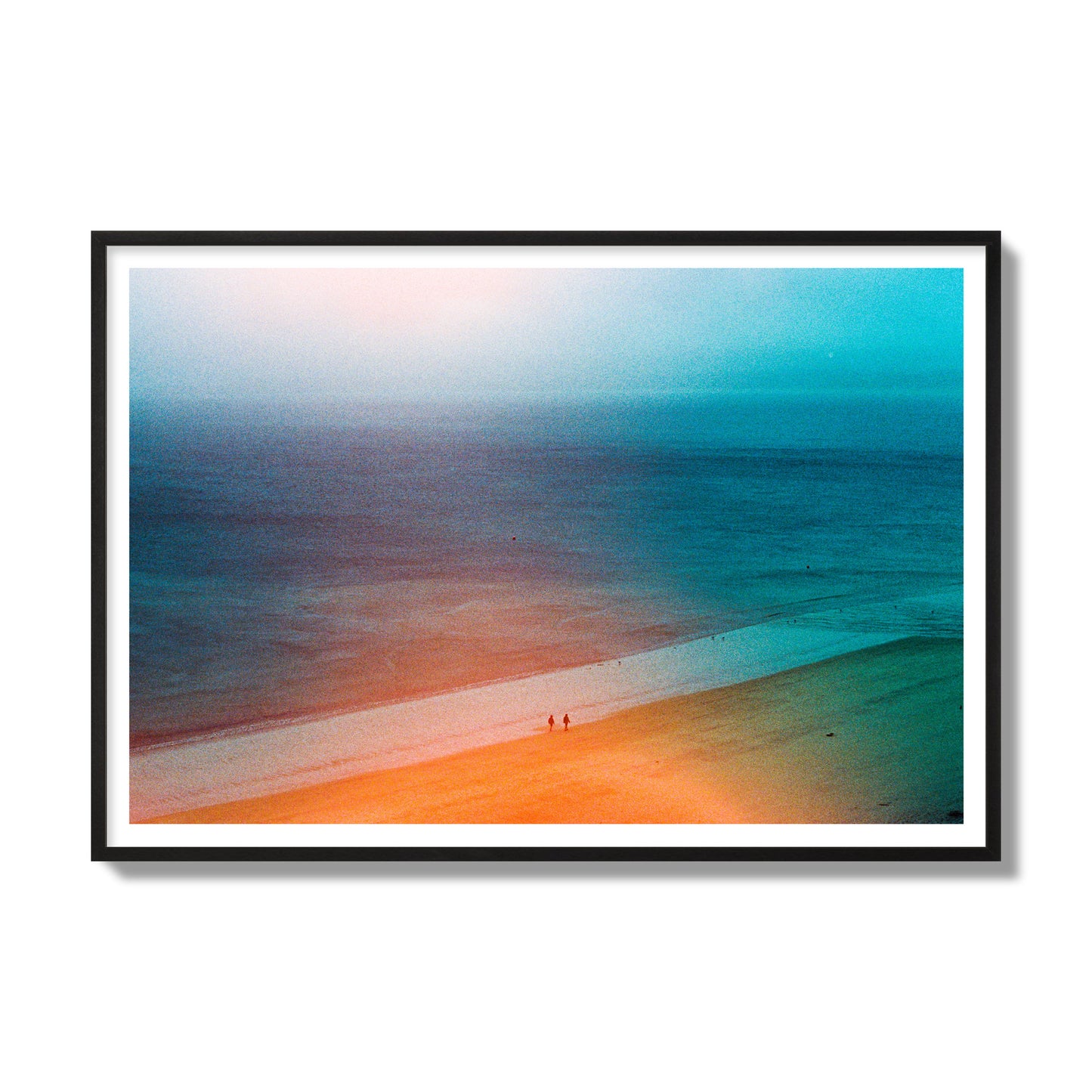 Fine art street photograph of a serene beach with two figures walking in the distance, captured in a dreamlike composition with soft orange and blue hues. Archival pigment print, gallery size, black frame.