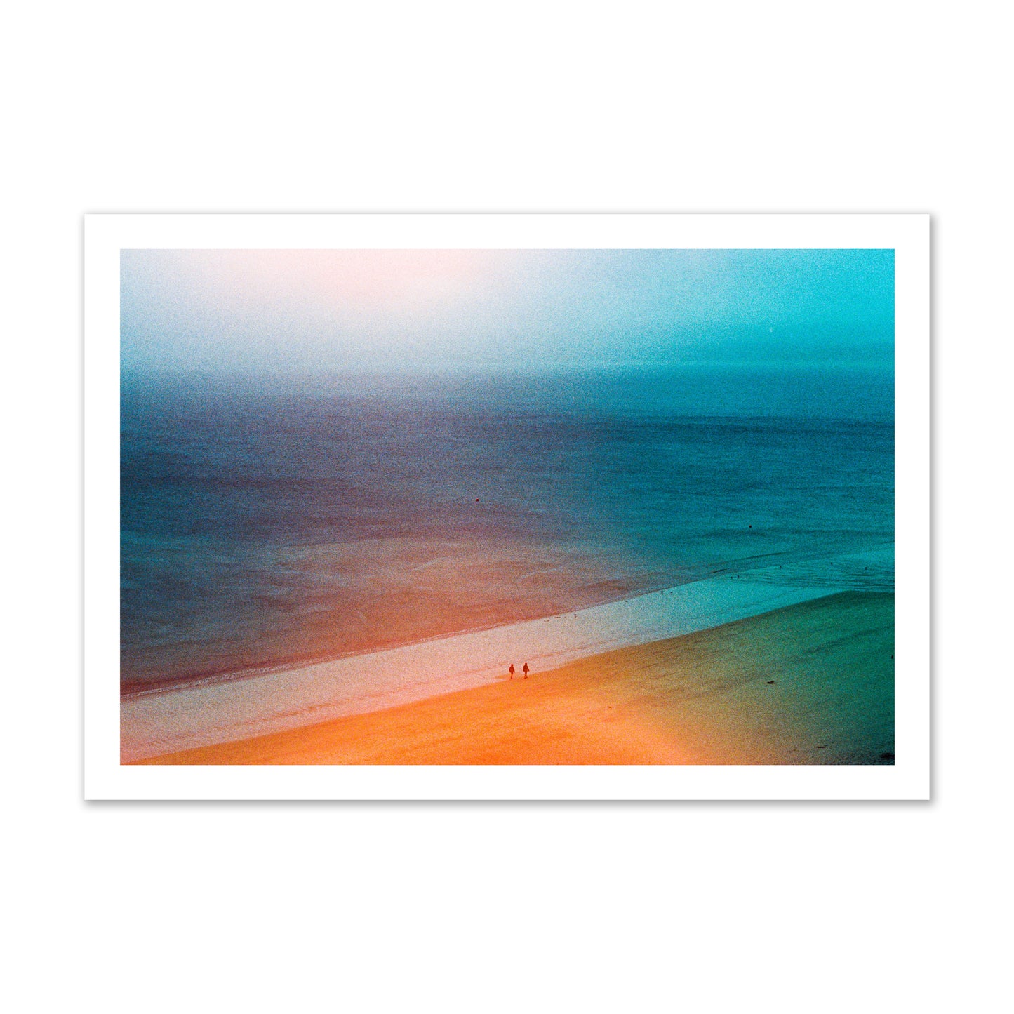 Fine art street photograph of a serene beach with two figures walking in the distance, captured in a dreamlike composition with soft orange and blue hues. Archival pigment print, gallery size, unframed.