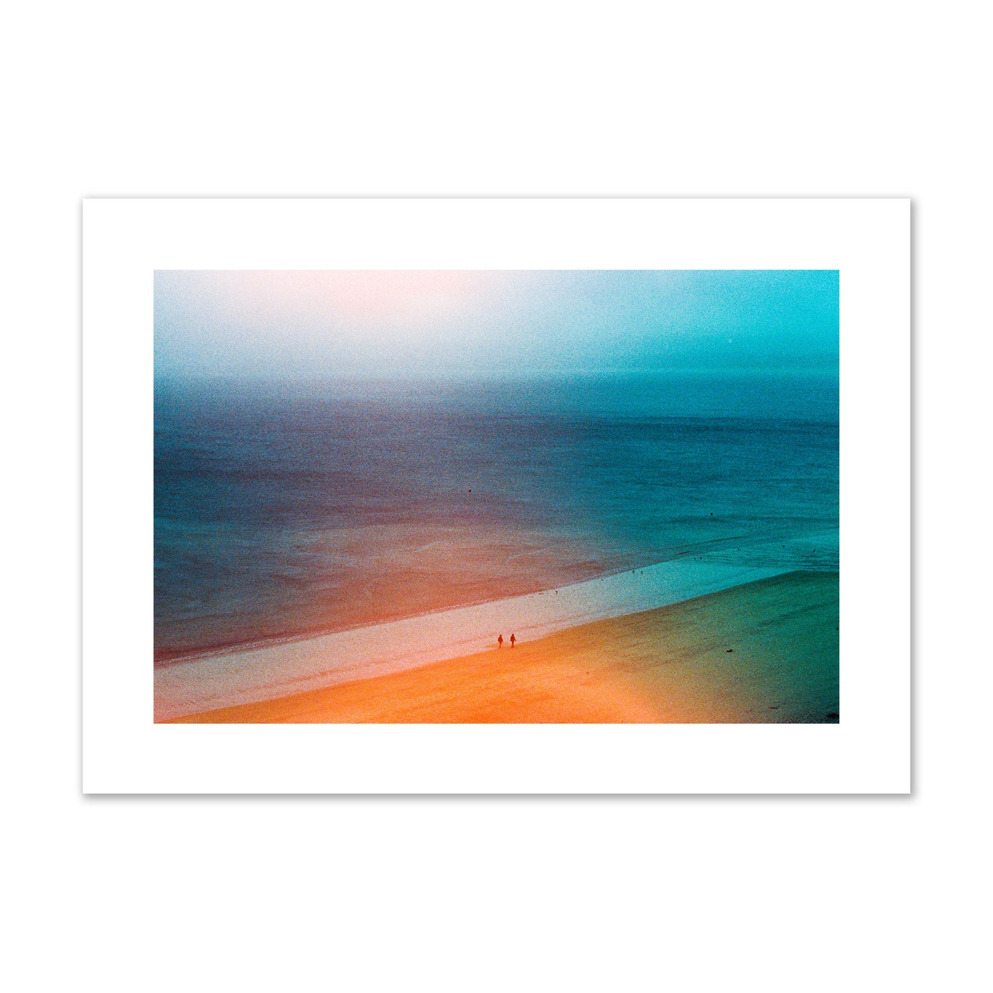Fine art street photograph of a serene beach with two figures walking in the distance, captured in a dreamlike composition with soft orange and blue hues. Archival pigment print, giant size, unframed.