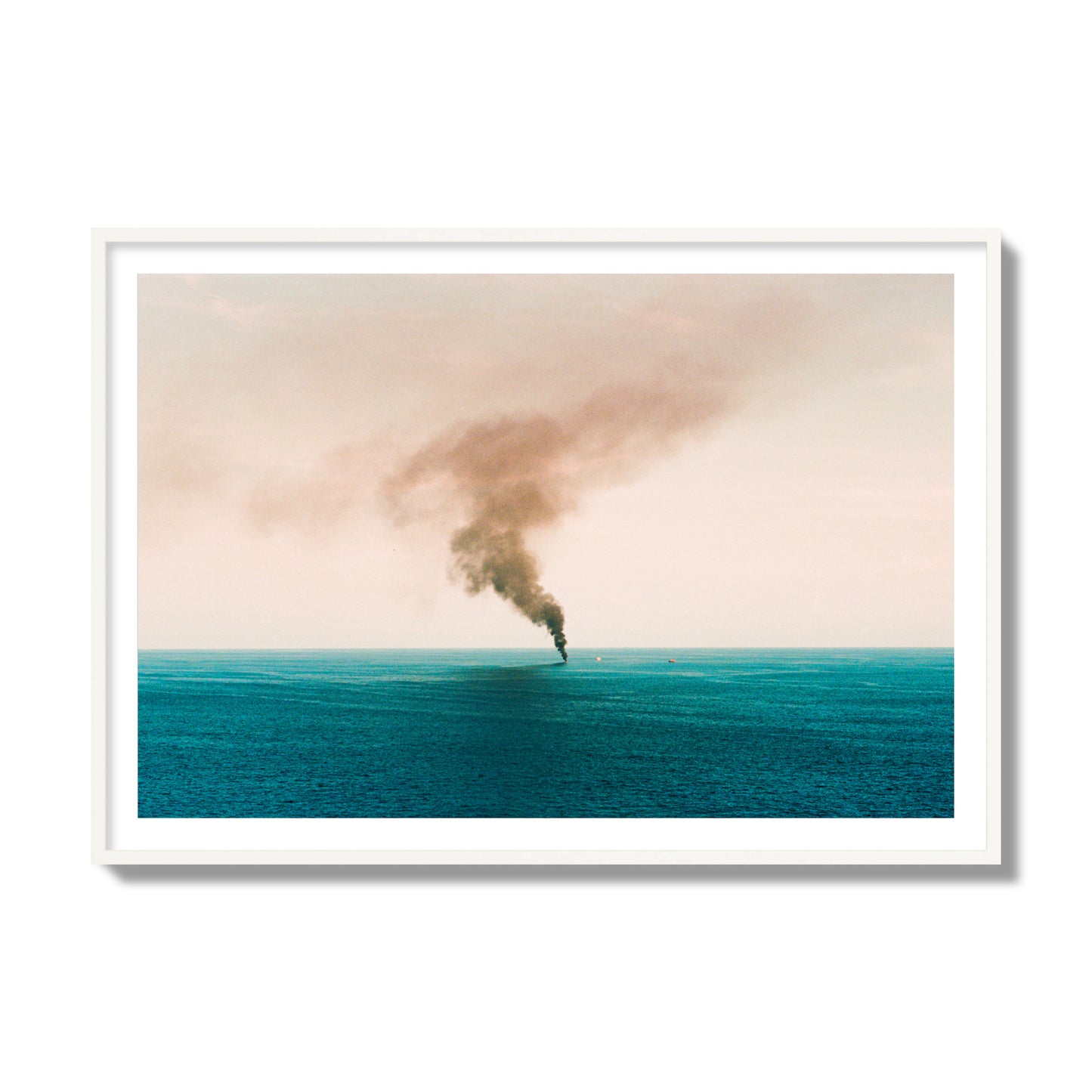 Fine art street photograph of a moody seascape with smoke rising from a distant boat, capturing a sense of mystery and atmosphere. Archival pigment print, collector size, white frame.