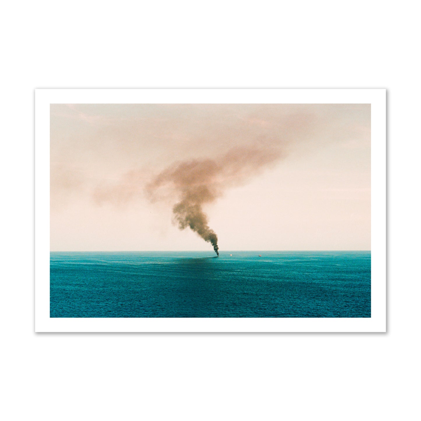 Fine art street photograph of a moody seascape with smoke rising from a distant boat, capturing a sense of mystery and atmosphere. Archival pigment print, gallery size, unframed.