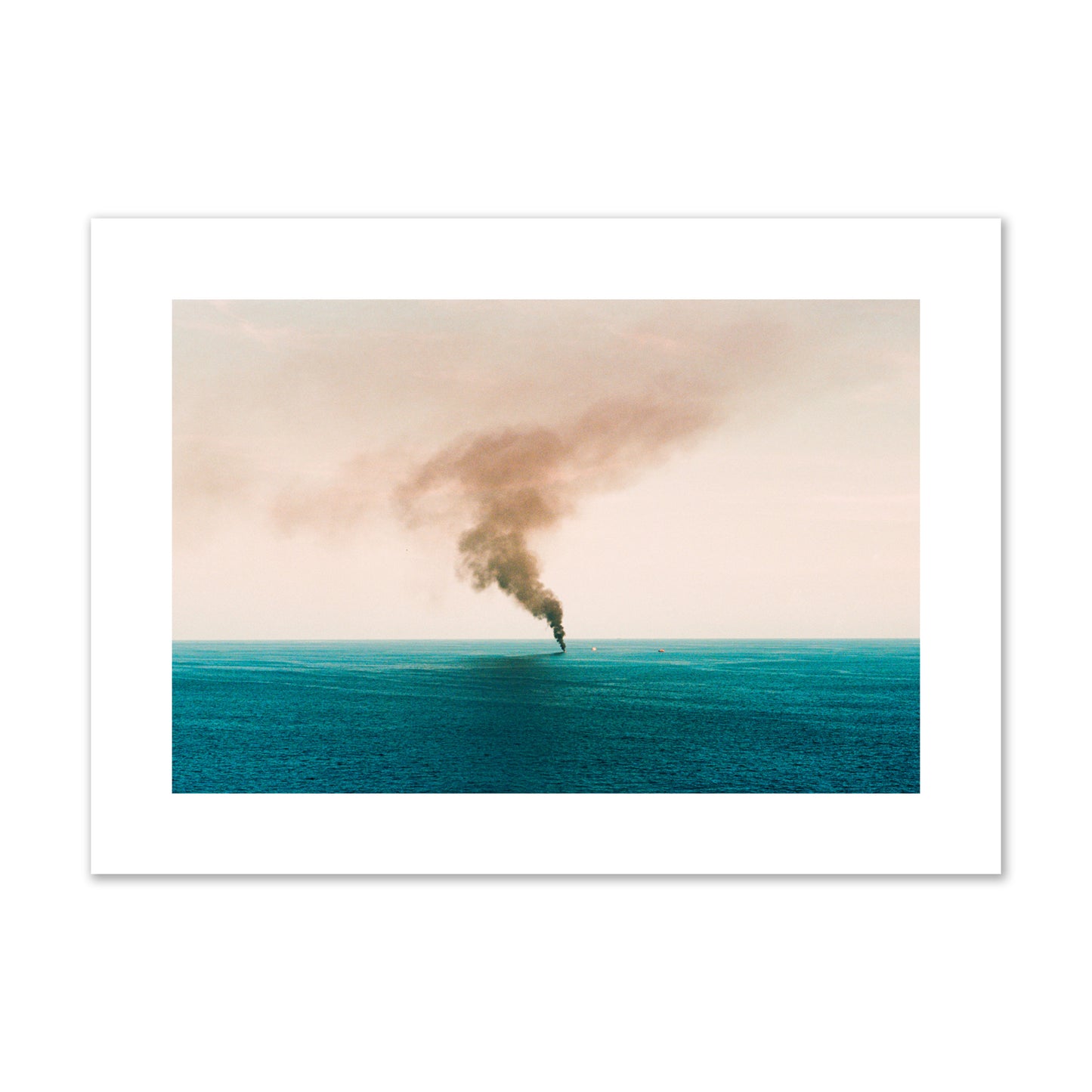 Fine art street photograph of a moody seascape with smoke rising from a distant boat, capturing a sense of mystery and atmosphere. Archival pigment print, large size, unframed.