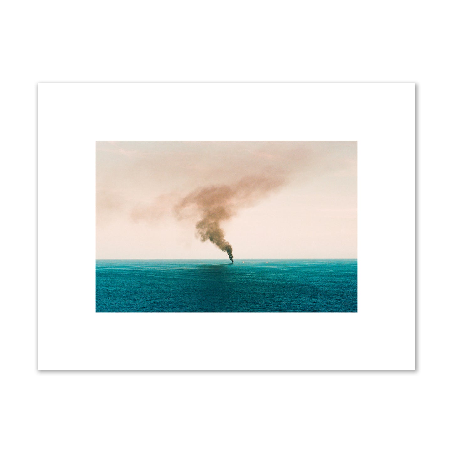 Fine art street photograph of a moody seascape with smoke rising from a distant boat, capturing a sense of mystery and atmosphere. Archival pigment print, small size, unframed.