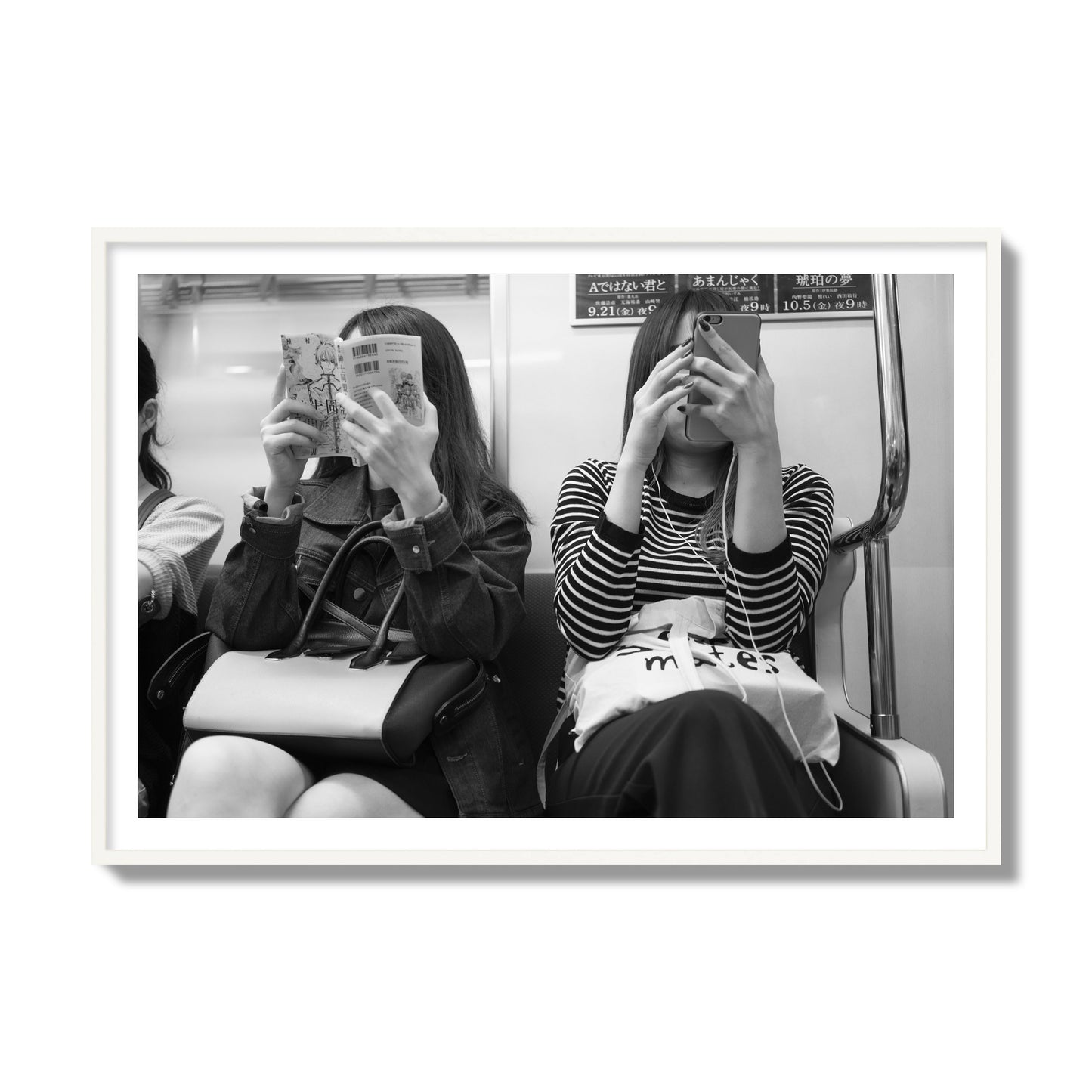 Black and white fine art photograph of two women on the Tokyo Metro, archival pigment print, collector size, white frame