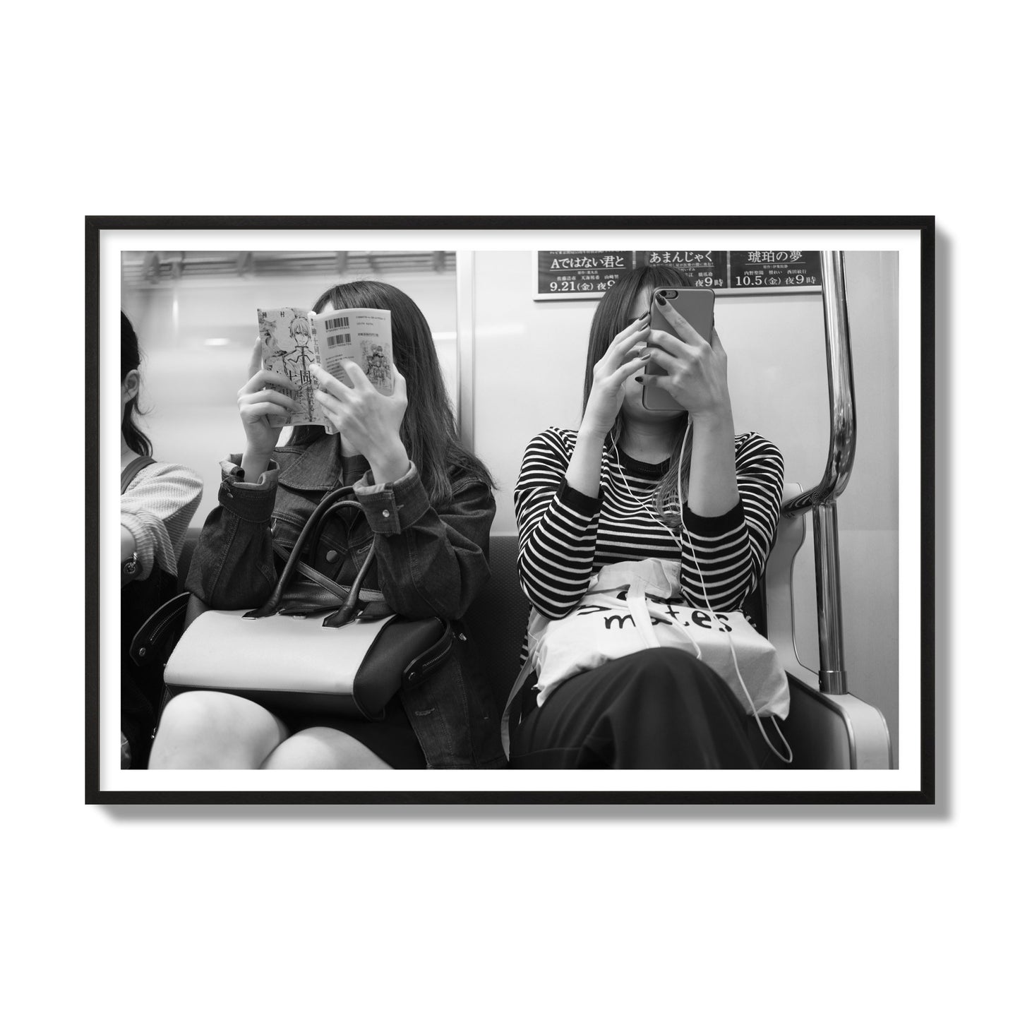 Black and white fine art photograph of two women on the Tokyo Metro, archival pigment print, gallery size, black frame