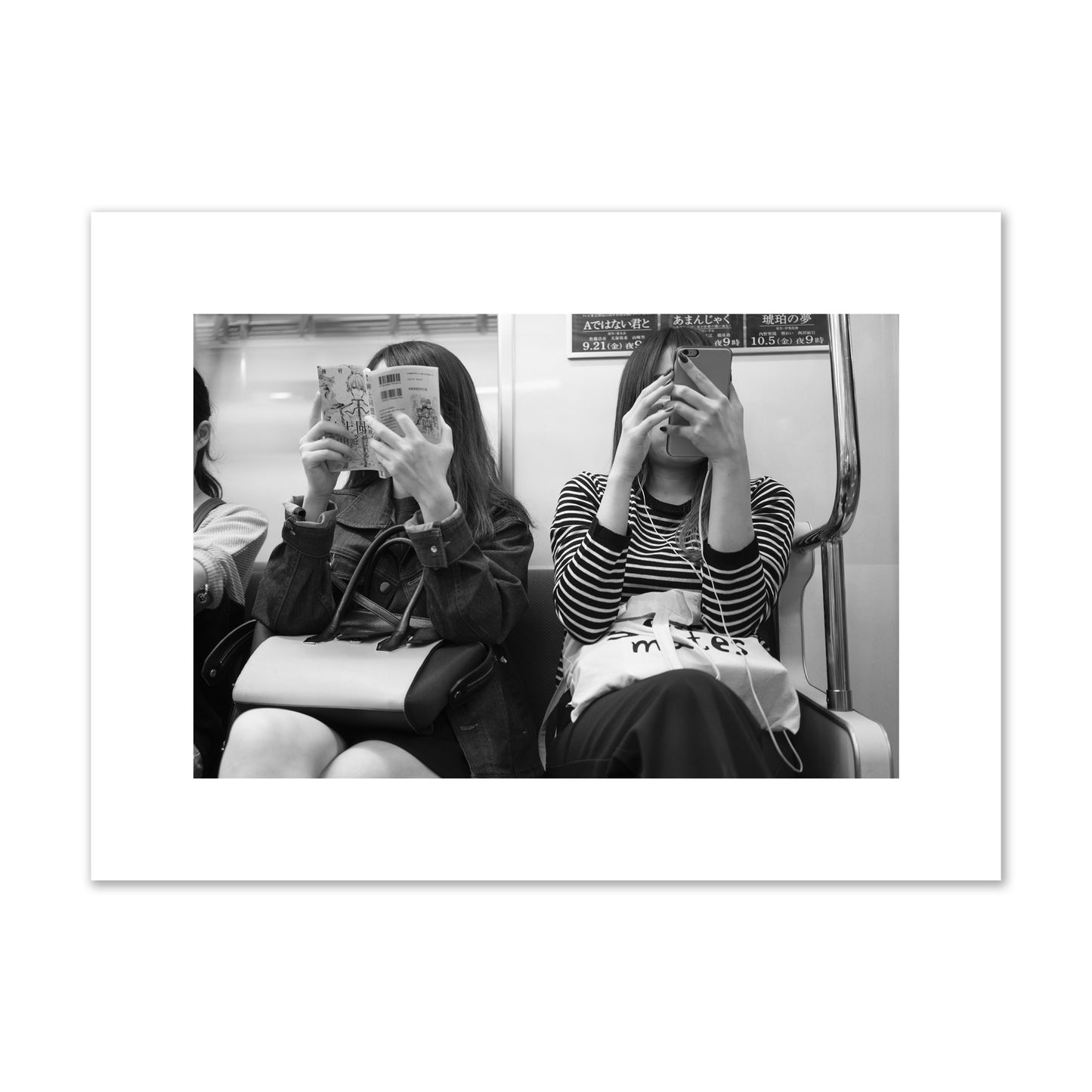 Black and white fine art photograph of two women on the Tokyo Metro, archival pigment print, medium size, unframed