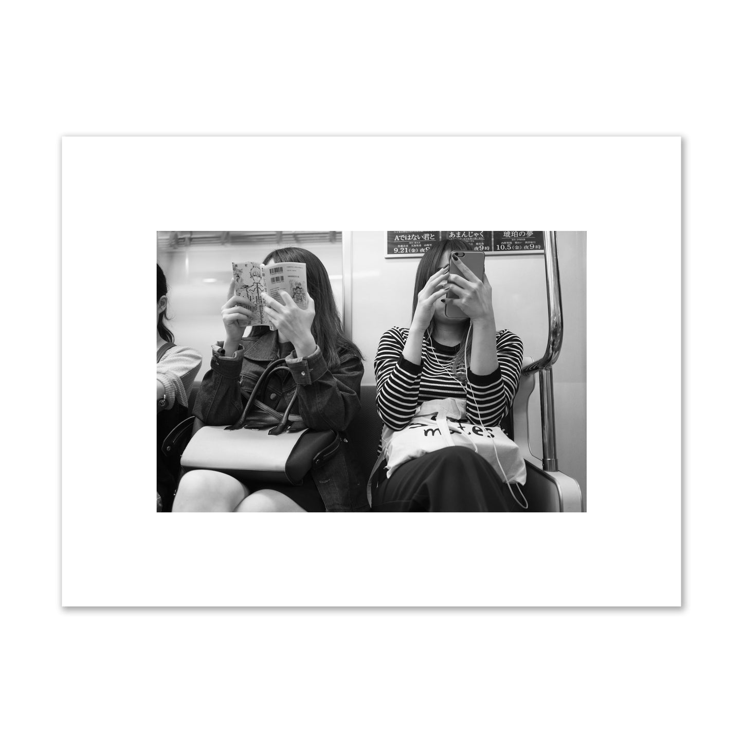 Black and white fine art photograph of two women on the Tokyo Metro, archival pigment print, unframed