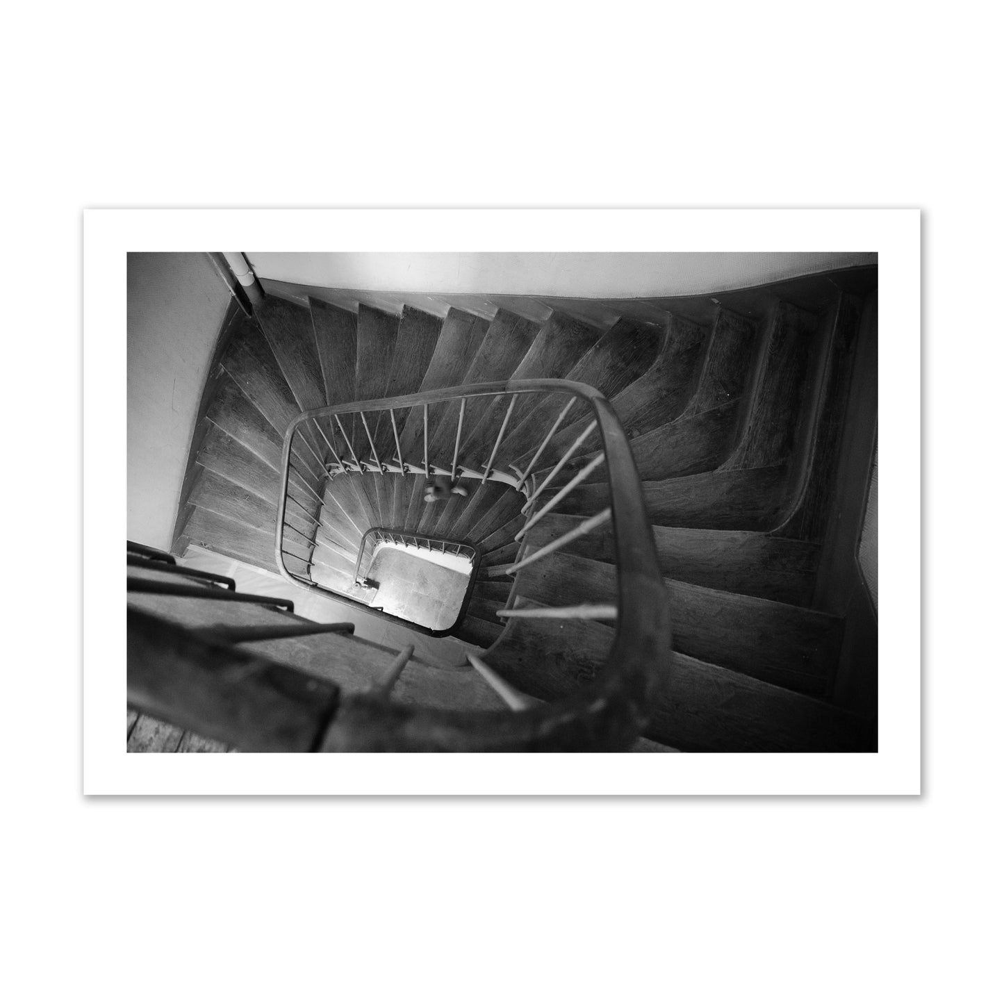 Fine art street photograph of a person walking down a staircase in Paris, France, archival pigment print, collector size, unframed