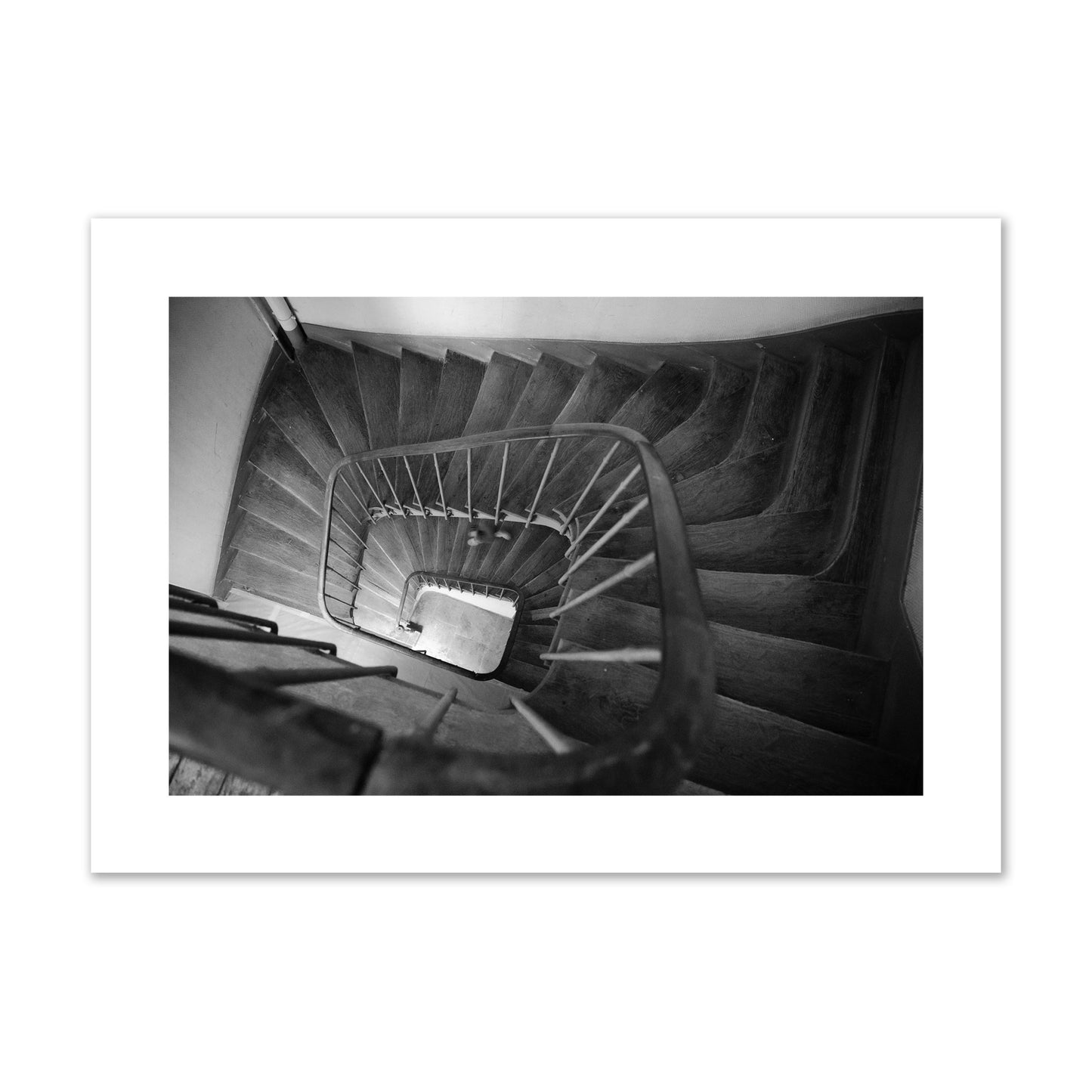 Fine art street photograph of a person walking down a staircase in Paris, France, archival pigment print, giant size, unframed