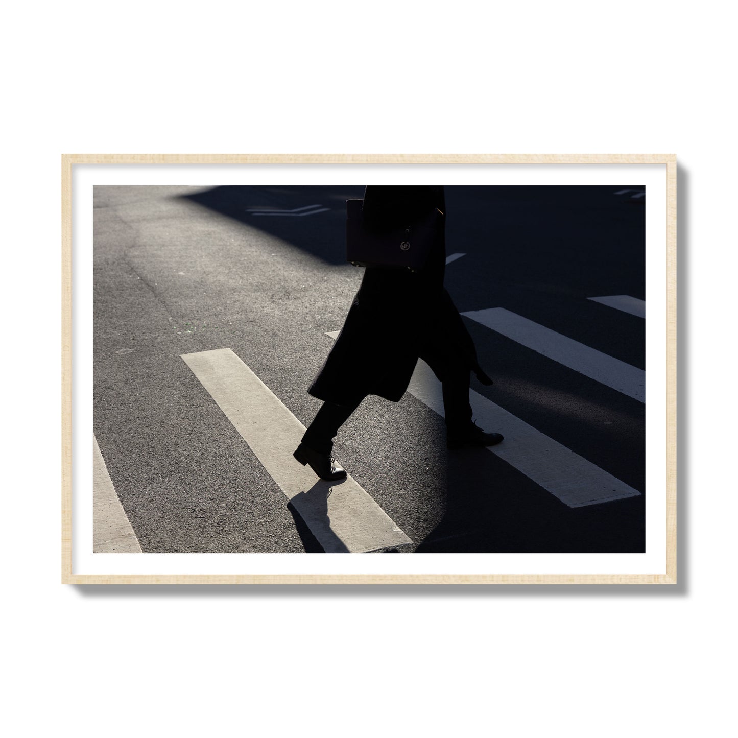 Fine art street photograph of a woman walking through a crosswalk in Soho New York, archival pigment print, collector size, natural wood frame